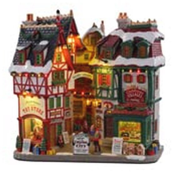 Joyeux Village de Noël Alimenté par Batterie avec Éclairage Coloré – 27,5 cm Joyeux Village de Noël Alimenté par Batterie avec Éclairage Coloré – 27,5 cm